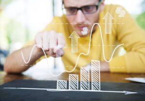 Businessman Learning the Graph with a Serious Face